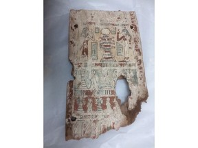This undated photo released by the Egyptian Foreign Ministry shows a part of a coffin that has been returned to Egypt by France. Egypt said Thursday, June 7, 2018, that it has repatriated nine illegally smuggled artifacts, including statuary and parts of coffins, from France. Thursday's statement by the Foreign Ministry says French authorities seized them at a train station in Paris in 2012. (Egyptian Foreign Ministry via AP)