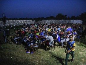 Egyptian fans gather to watch the group A World Cup match between Egypt and Russia at a cafe in the hometown of Liverpool star striker Mohammed Salah, in the Nile delta village of Nagrig, Egypt, Tuesday, June 19, 2018.