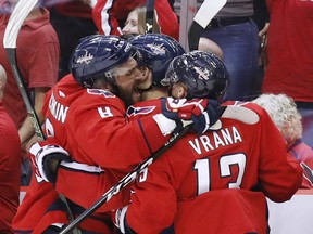 Members of the Washington Capitals including Alex Ovechkin, left, and Jakab Vrana celebrate one of six goals the Caps were to score against the Vegas Golden Knights in a 6-2 victory Monday night in Game 4 of the Stanley Cup final in Washington.The victory gives the Caps a 3-1 series edge heading back to Las Vegas for Game 5 on Thursday.