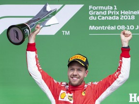 Ferrari's Sebastian Vettel of Germany celebrates his victory at the Canadian Grand Prix Sunday in Montreal.