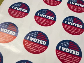 "I Voted" stickers wait for voters at a polling station inside the library at Robert F. Kennedy Elementary School in Los Angeles on Tuesday, June 5, 2018.   Voters are casting ballots in California's primary election, setting the stage for November races.