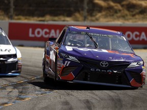 Denny Hamlin (11) drives through Turn 4 during afternoon practice for a NASCAR Cup Series auto race at Sonoma Raceway in Sonoma, Calif., Friday, June 22, 2018.