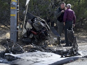 San Bernardino County Sheriff's officials work at the scene of a fatal plane crash near Hesperia Airport on Friday, June 15, 2018, in Hesperia, Calif.
