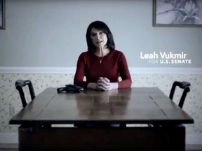 This frame grab from a video provided by the Leah for Senate campaign, shows Leah Vukmir, a Wisconsin Republican U.S. Senate candidate, sitting at a kitchen table with a handgun next to her as she talks about death threats she received. Vukmir's ad Monday, June 18, 2018, is the first from a Republican candidate in the primary. She's running against Delafield management consultant Kevin Nicholson. The winner will face Democratic Sen. Tammy Baldwin. (Leah for Senate campaign via AP)