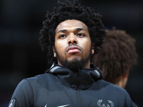 FILE - In this April 1, 2018, file photo, Milwaukee Bucks guard Sterling Brown is seen during an NBA basketball game in Denver. Brown filed a lawsuit Tuesday, June 19, 2018, against the city of Milwaukee and its police department, claiming unlawful arrest and excessive force when officers used a stun gun on him during his arrest in January 2018 for a parking violation.