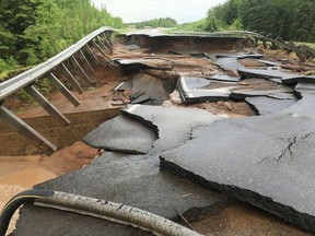 This Sunday, June 17, 2018, photo provided by the Minnesota Department of Transportation shows Minnesota Highway 23 damaged by flash flooding at the south fork Nemadji River crossing near Wrenshall, Minn. The National Weather Service has since extended a flood warning through Thursday for northwestern Wisconsin and neighboring areas in Minnesota.