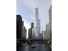 In this Nov. 8, 2013 file photo, boats move along the Chicago River near the Trump International Hotel and Tower, center, in Chicago. The Trump Tower is among the largest users of water from the Chicago River, but records show it has never met Environmental Protection Agency rules for protecting fish. City records indicate the skyscraper siphons nearly 20 million gallons a day for its cooling systems. Regulations limit the number of fish that can be trapped or killed during that processes. Records show Trump Tower has failed to document it followed those rules.