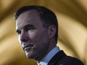Minister of Finance Bill Morneau participates in a TV interview on Parliament Hill in Ottawa on February 27, 2018.