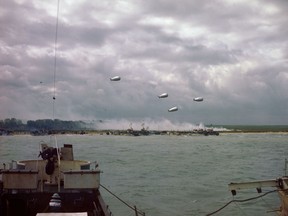 D-Day operations being witnessed from Canadian landing craft parked just off the Normandy coast.