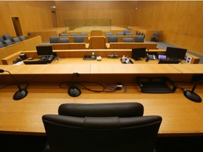 The judge's chair rests at the centre of the bench in the largest courtroom in the Quinte Courthouse Thursday September 5, 2013 in Belleville, Ont. In what is believed to be a legal first in Canada, a court in Newfoundland and Labrador has recognized three unmarried adults as the legal parents of a child born within their “polyamorous” family.