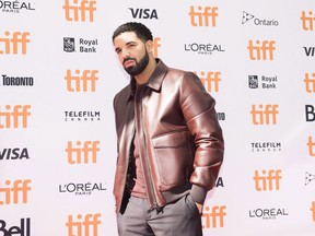 Canadian rapper Drake poses for photographs on the red carpet for the new documentary "The Carter Effect" during the 2017 Toronto International Film Festival in Toronto on September 9, 2017. Drake often boasts about his chart successes and wallows in heartaches, but on his latest album "Scorpion," the Toronto superstar has delivered a confessional the likes we've never heard from him before. The rapper and singer unleashed an explosive 25-track album onto streaming music services on Friday which appeared to confirm that he secretly fathered his first child -- putting to rest a rumour that's been circulating on gossip websites.