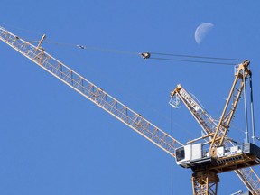 A construction crane is seen in Montreal on October 12, 2017. Crane operators are off the job today across Quebec, angry over new provincial training requirements.There are about 2,000 crane operators in the province and they aren't pleased that people without a vocational diploma will be able to obtain a crane operator's certificate.