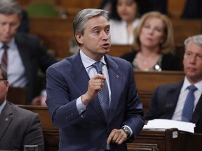 Minister of International Trade Francois-Philippe Champagne rises in the House of Commons during Question Period in Ottawa on June 11, 2018. Facing intense pressure on many trade fronts, the Canadian government is trying to sell the merits of the Canada-Europe free trade deal with Italy's new government as media reports say Rome is refusing to ratify the agreement. A spokesman for Francois-Philippe Champagne says the international trade minister visited Italy a few days ago to pitch the Comprehensive Economic Trade Agreement, or CETA, to Italy's populist government, which took power on June 1.