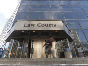 People enter the Law Courts in Winnipeg on February 5, 2018. A former educational assistant in Winnipeg has been sentenced to 3.5 years behind bars for having a sexual relationship with a student. Sheryl Dyck, who was 42 at the time, was arrested in 2015 after a seven-month relationship with the then 16-year-old.