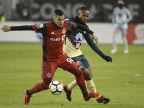 Toronto FC defender Auro (96) battles for the ball with Club America midfielder William Da Silva (7) during first half CONCACAF Champions League semifinal action in Toronto on April 3, 2018. Only three Toronto FC players have seen more MLS playing time than Auro this season. The Brazilian newcomer has proved to be durable, adaptable and near indispensable.