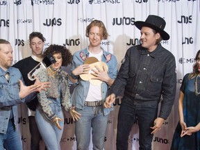 Arcade Fire celebrates their Juno for Album of the year at the Juno Awards in Vancouver on March 25, 2018. Rising R&B singer Daniel Caesar's debut, the latest effort by Arcade Fire, and a posthumous work from Gord Downie are among the long-listed albums for the Polaris Music Prize. The juried award for best Canadian album of the year was narrowed down to 40 contenders who could qualify for the short list revealed next month. Among the projects named is "Everything Now," the disco-rock social statement released last year by Arcade Fire, who previously won the Polaris for "The Suburbs" in 2011.