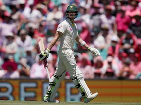 Australia's Steve Smith walks off after he was caught and bowled by England's Moeen Ali during the third day of their Ashes cricket Test match in Sydney on January 6, 2018. The Global T20 Canada cricket tournament kicks off Thursday north of Toronto with West Indies stars Darren Sammy and Chris Gayle leading teams from Toronto and Vancouver, respectively. But many eyes will be on Steve Smith, the former Australian captain making his return to cricket after a high-profile ball-tampering scandal.