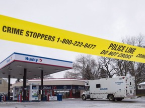Homicide detectives investigate at a Mac's convenience store in Edmonton on Friday, December 18, 2015. A Crown prosecutor says two different people shot and killed two Edmonton Mac's clerks on the same day in 2015. John Watson made the statement during his brief opening address to a jury in the month-long trial of Laylin Delorme.