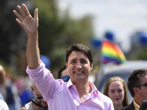 Prime Minister Justin Trudeau marches in the Ottawa Capital Pride parade, Sunday, Aug. 27, 2017. A teenager behind an Ontario town's first Pride parade was still getting over his surprise on Thursday at having found himself taking a congratulatory phone call from Prime Minister Justin Trudeau.THE CANADIAN PRESS/Justin Tang