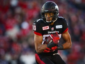 Calgary Stampeders' Eric Rogers comes down with a touchdown catch during first half CFL western semifinal football action against the BC Lions in Calgary, Sunday, Nov. 15, 2015. Rogers is returning to the Calgary Stampeders. The CFL team is hoping the 27-year-old can pick up where he left off in 2015, when he totalled 87 catches for 1,448 yards and 10 touchdowns before heading to the NFL.