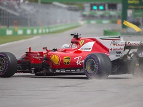 Ferrari driver Sebastian Vettel, of Germany, spins during a turn at the Senna corner during the first practice session at the Canadian Grand Prix in Montreal, Friday, June 9, 2017. The racing division of the famous Italian car company, Ferrari, was ridiculed online Tuesday after it tweeted about this weekend's upcoming Formula One race in Montreal using an image of downtown Toronto.