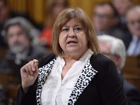 Labour Minister MaryAnn Mihychuk answers a question during question period in the House of Commons on Parliament Hill in Ottawa on Monday, October 24, 2016. A member of parliament is denying an accusation she caused a disturbance, created confusion and was verbally abusive at an emergency shelter for forest fire evacuees in Winnipeg last summer.