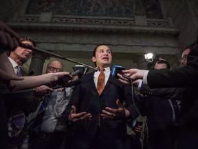 Leader of the Opposition in the Manitoba Legislative Assembly Wab Kinew scrums following the 2018 budget at the Manitoba Legislature, in Winnipeg on Monday, March 12, 2018. A Manitoba politician wants members of the Tory government to be forbidden from discussing Opposition Leader Wab Kinew's criminal convictions and other brushes with the law inside the legislature.