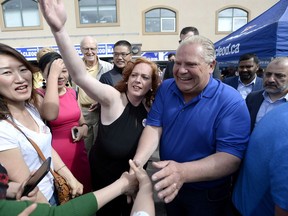 Ontario PC leader Doug Ford greets supporters as he arrives for a breakfast meet and greet in Ottawa on Saturday, June 2, 2018.