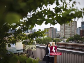 Ontario Liberal Leader Kathleen Wynne speaks to the media as Liberal Candidate Li Koo looks on during a campaign event in Toronto on Wednesday, June 6, 2018. Wynne has already acknowledged she won't be Ontario's premier after today's election, but the fate of her Liberal party now rests on how well her last-minute plea for support has resonated with voters as they head to the polls.