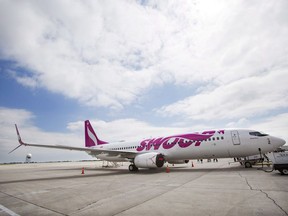 A Swoop Airlines Boeing 737 is on display during their media event, Tuesday, June 19, 2018 at John C. Munro International Airport in Hamilton, Ont.