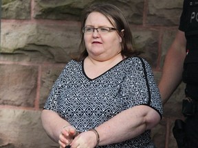 Elizabeth Wettlaufer is escorted by police from the courthouse in Woodstock, Ont., on June 26, 2017. A public inquiry examining the circumstances that allowed a long-term care nurse to kill elderly patients in her care is set to get underway this week. The probe will examine the systemic factors that allowed Elizabeth Wettlaufer to inject more than a dozen patients with overdoses of insulin while working at long-term care homes and private residences in southwestern Ontario for nearly a decade.