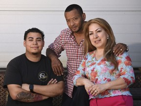 Stamford, Conn., resident Nelson Rosales Santos, center, poses with his wife, Patricia Morales, and son, Christian, outside Building One Community in Stamford, Conn. Thursday, June 14, 2018. Federal immigration officials granted a six-month reprieve Thursday to Nelson Rosales Santos, a Connecticut immigrant facing deportation, a move that may allow him to undergo a scheduled kidney transplant.