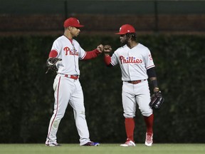 Philadelphia Phillies' Nick Williams, left, and Odubel Herrera celebrate the team's 6-1 win over the Chicago Cubs in a baseball game Tuesday, June 5, 2018, in Chicago.