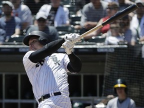 Chicago White Sox's Avisail Garcia hits a single during the first inning of a baseball game against the Oakland Athletics, Saturday, June 23, 2018, in Chicago.