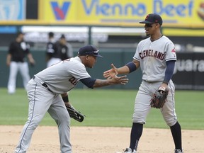 Cleveland Indians' Jose Ramirez, left, and Francisco Lindor celebrate the team's 5-2 win over the Chicago White Sox after a baseball game Thursday, June 14, 2018, in Chicago.