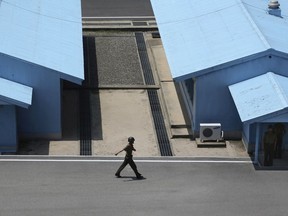 A North Korean soldier marches at the truce village at the Demilitarized Zone (DMZ) which separates the two Koreas in Panmunjom, North Korea, Wednesday, June 20, 2018. Since the summits between North Korean leader Kim Jong Un and the presidents of South Korea and the United States, things have quieted down noticeably in perhaps the most iconic symbol of the one last place on Earth where the Cold War still burns hot.
