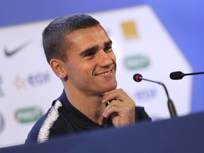 France's Antoine Griezmann smiles as he answers to journalists during a press conference at the 2018 soccer World Cup in Istra, Russia, Tuesday, June 12, 2018.