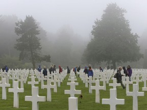 School children visit the Colleville American military cemetery, in Colleville sur Mer, western France, Wednesday June 6, 2018, on the 74th anniversary of the D-Day landing. U.S. and other allied troops have joined veterans of the D-Day invasion and families of fallen soldiers to mark 74 years since the massive military operation that change the course of World War II.