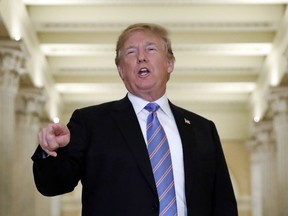 President Donald Trump speaks in the Hall of Columns as he arrives on Capitol Hill in Washington, Tuesday, June 19, 2018, to rally Republicans around a GOP immigration bill.