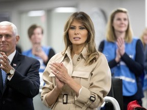 First lady Melania Trump, center, accompanied by Vice President Mike Pence, left, applauds as President Donald Trump speaks to employees at the Federal Emergency Management Agency Headquarters, Wednesday, June 6, 2018, in Washington.