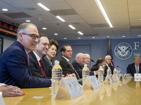 President Donald Trump, right, accompanied by from left, Environmental Protection Agency Administrator Scott Pruitt, Acting Secretary of Veterans Affairs Peter O'Rourke, Transportation Secretary Elaine Chao, Health and Human Services Secretary Alex Azar, Agriculture Secretary Sonny Perdue, Attorney General Jeff Sessions, Secretary of State Mike Pompeo, and Vice President Mike Pence, speaks at a briefing on this year's hurricane season at the Federal Emergency Management Agency Headquarters, Wednesday, June 6, 2018, in Washington.