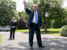 President Donald Trump, center, accompanied by Secretary of State Mike Pompeo, left, speaks to members of the media on the South Lawn outside the Oval Office in Washington, Friday, June 1, 2018, after meeting with former North Korean military intelligence chief Kim Yong Chol. After the meeting Trump announced that the Summit with North Korea will go forward.