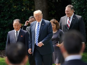 President Donald Trump walks with Kim Yong Chol, left, former North Korean military intelligence chief and one of leader Kim Jong Un's closest aides, after their meeting in the Oval Office of the White House in Washington, Friday, June 1, 2018, as Secretary of State Mike Pompeo follow at right.