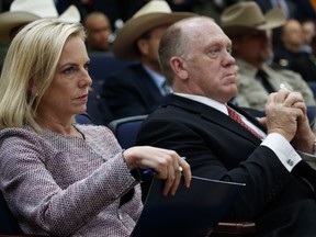 Secretary of Homeland Security Kirstjen Nielsen, left, and Immigration and Customs Enforcement acting director Thomas Homan listen as President Donald Trump delivers remarks on immigration alongside family members affected by crime committed by undocumented immigrants, at the South Court Auditorium on the White House complex, Friday, June 22, 2018, in Washington.