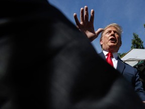 President Donald Trump speaks to reporters at the White House, Friday, June 15, 2018, in Washington.