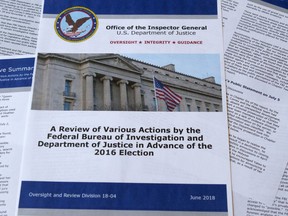 Part of the the Department of Justice Inspector General's report after its release in Washington, Thursday, June 14, 2018. The report documented in painstaking detail one of the most consequential investigations in modern FBI history and revealed how the bureau, which for decades has endeavored to stand apart from politics, came to be entangled in the 2016 presidential election.