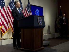 FBI Director Christopher Wray speaks during a news conference on the inspector general's report at FBI headquarters on Thursday, June 14, 2018, in Washington.