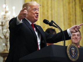 President Donald Trump gestures as he speaks about taxes, Friday, June 29, 2018, during an event in the East Room of the White House in Washington.