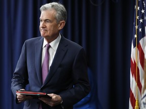 Federal Reserve Chair Jerome Powell arrives to a news conference after the Federal Open Market Committee meeting, Wednesday, June 13, 2018, in Washington.  The Federal Reserve took note of a resilient U.S. economy Wednesday by raising its benchmark interest rate for the second time this year and signaling that it may step up its pace of rate increases. The Fed now foresees four rate hikes this year, up from the three it had previously forecast.