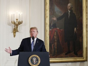 President Donald Trump speaks before awarding the Medal of Honor posthumously to 1st Lt. Garlin Conner during a ceremony in the East Room of the White House in Washington, Tuesday, June 26, 2018. Conner is being recognized for actions on Jan. 24, 1945, when he left a position of relative safety for a better position "to direct artillery fire onto the assaulting enemy infantry and armor." Conner remained in an exposed position for three hours, despite German forces coming within five yards of his position and friendly artillery shells exploding around him.